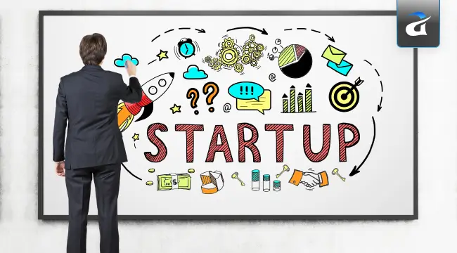 A Startup Team Preparing Their Booth at a Tech Conference