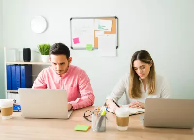 Graphic Showing a Freelancer Standing in Front of a Website Screen with SEO Icons